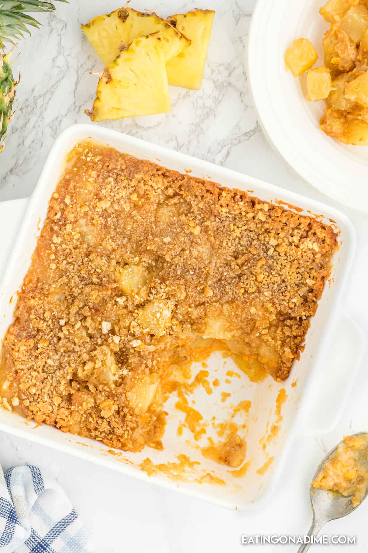 Close up image of pineapple casserole in a baking dish 