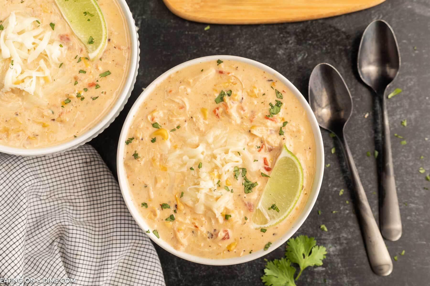 Close up image of Mexican Corn Chowder in a white bowl with a spoon