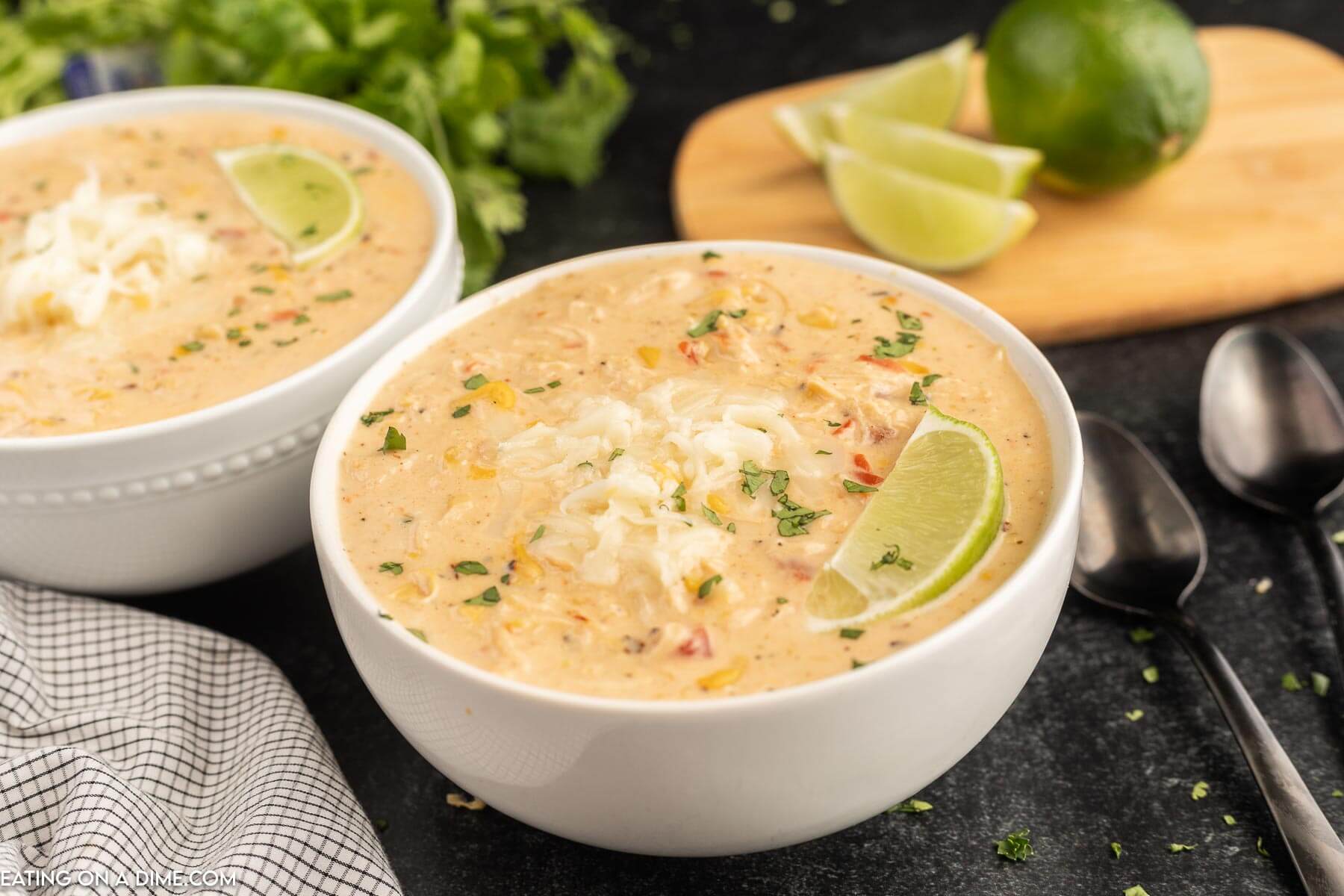 Close up image of Mexican Corn Chowder in a white bowl with a spoon