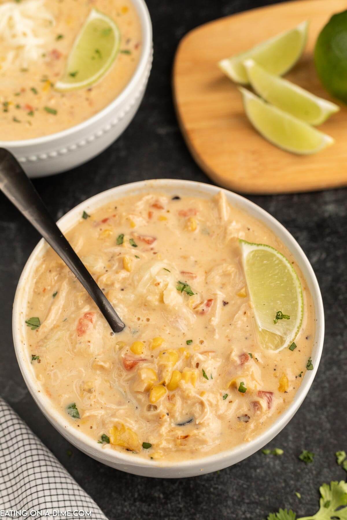 Close up image of Mexican Corn Chowder in a white bowl with a spoon