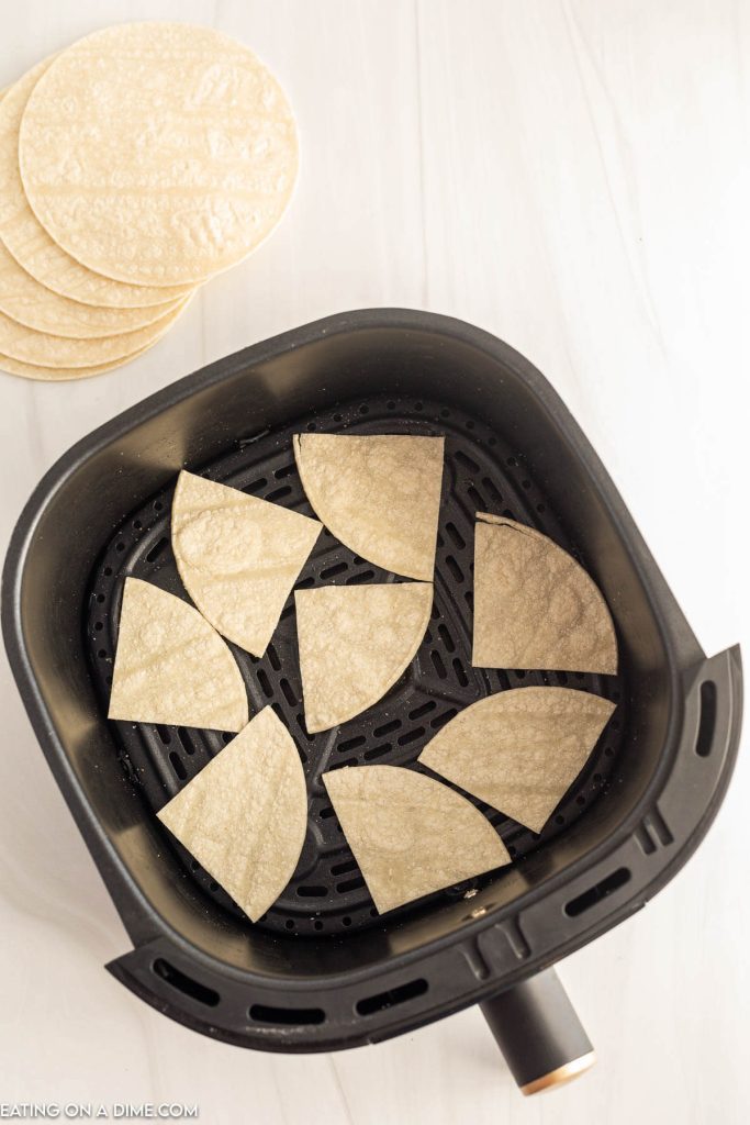Placing triangle shaped tortilla in a air fryer