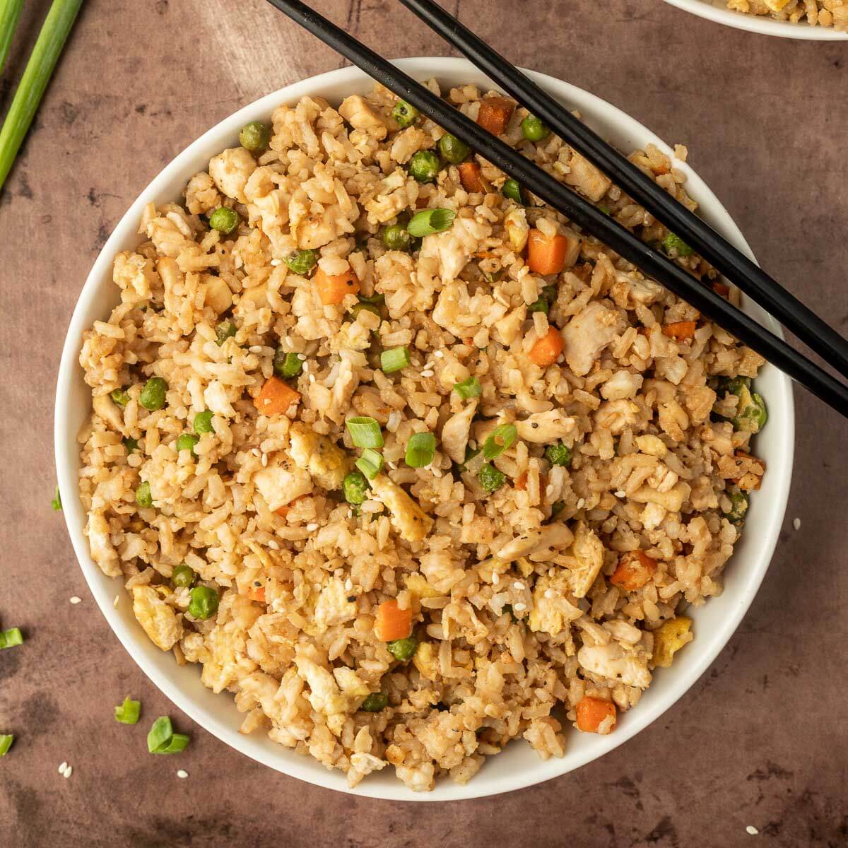 Chicken Fried Rice in a white bowl with chopsticks