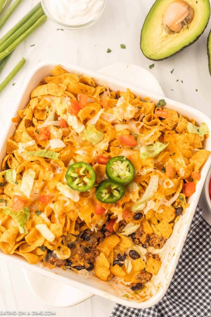 Walking Taco Casserole topped with slice jalapenos