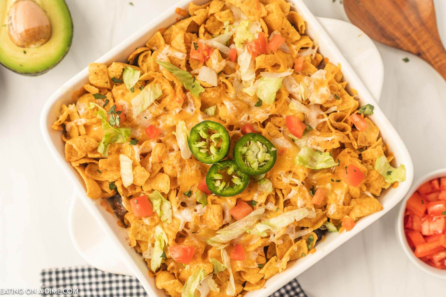 Walking Taco Casserole topped with slice jalapenos