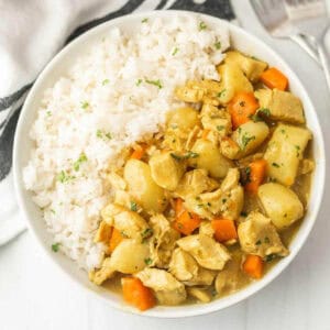 Chicken curry and rice in a bowl.