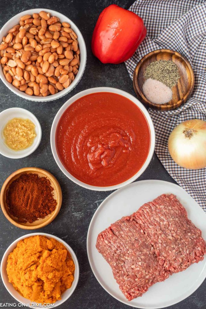 Ingredients needed - beef, pumpkin puree, tomato sauce, pinto beans, beef broth, chili powder, salt and pepper, onion, red bell pepper, minced garlic, sour cream, cheese, green onions