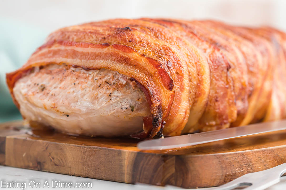 Bacon Wrapped Pork Loin on a cutting board