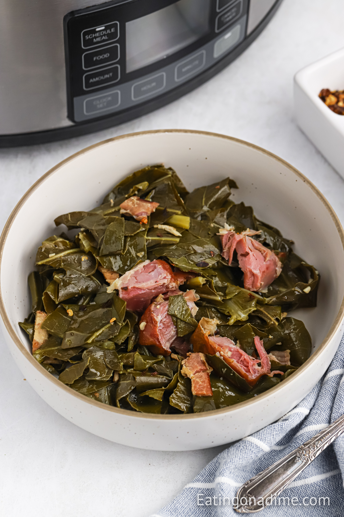 Collard greens with ham hock in a bowl 