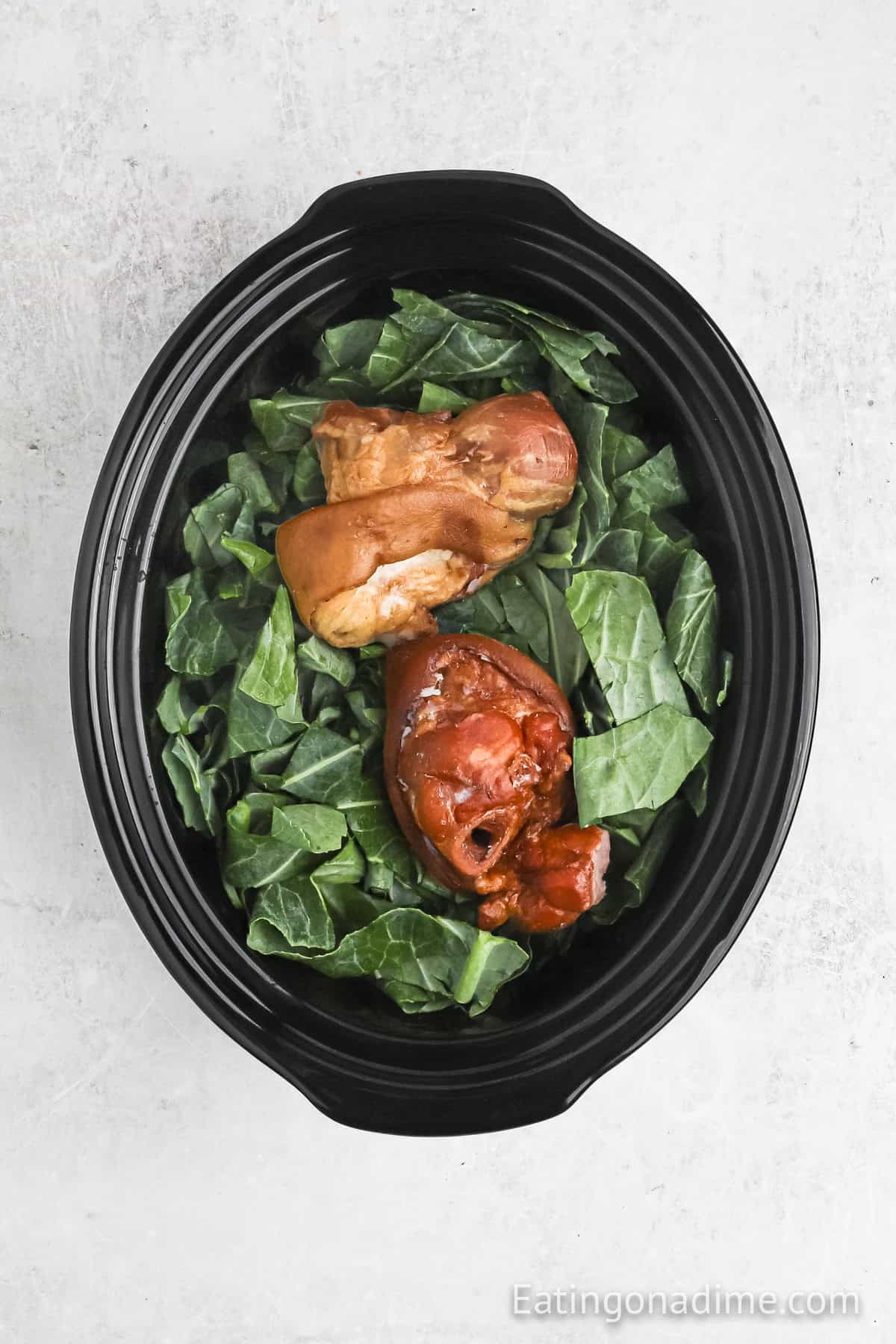 Greens with ham hocks in the crockpot.
