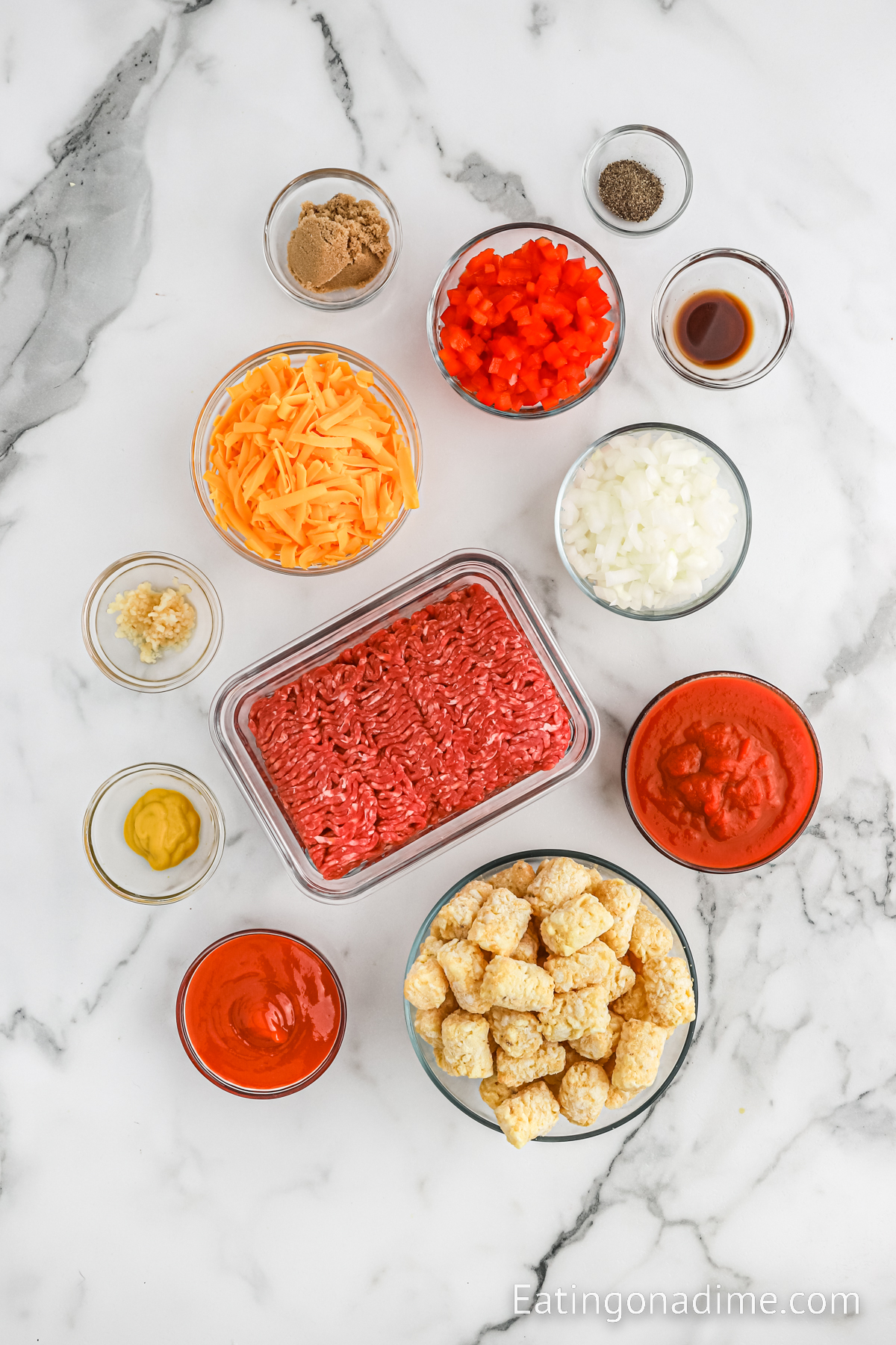 Ingredients needed - ground beef, red bell pepper, onion, minced garlic, tomato sauce, ketchup, brown sugar, mustard, worcestershire sauce, black pepper, cheese, tator tots