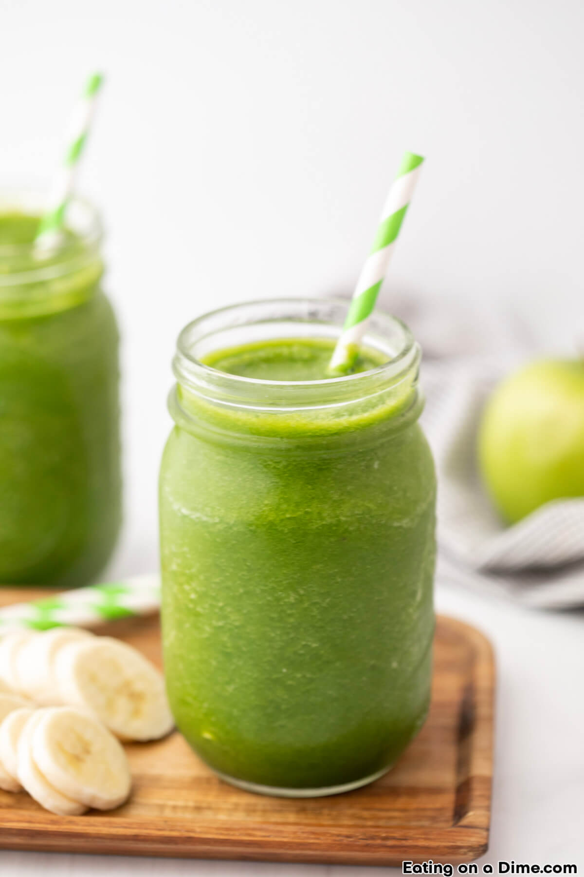 Green Smoothie in a mason jar with a striped straw