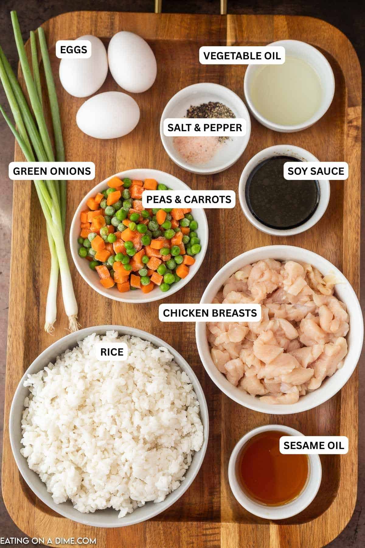 No need to get take out when you can make this easy chicken fried rice recipe at home. In 15 minutes, your family can enjoy authentic chicken fried rice. Ingredients for recipe: sesame oil, rice, chicken breasts, peas, carrots, soy sauce, green onions, salt,, pepper, eggs, oil.