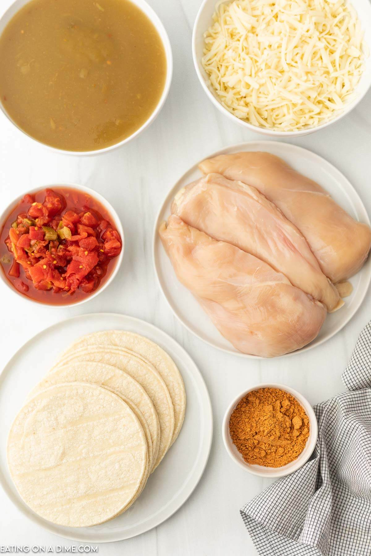 cooked chicken, taco seasoning, diced tomatoes, green enchilada sauce, cheese, corn tortillas