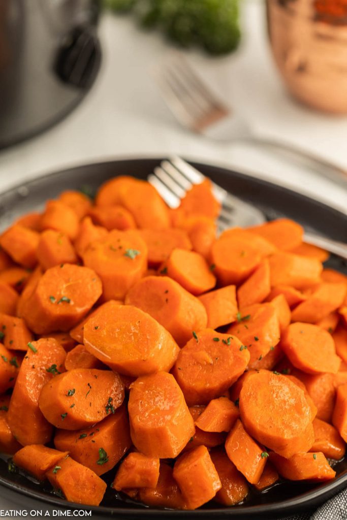 Close up image of glazed carrots on a plate
