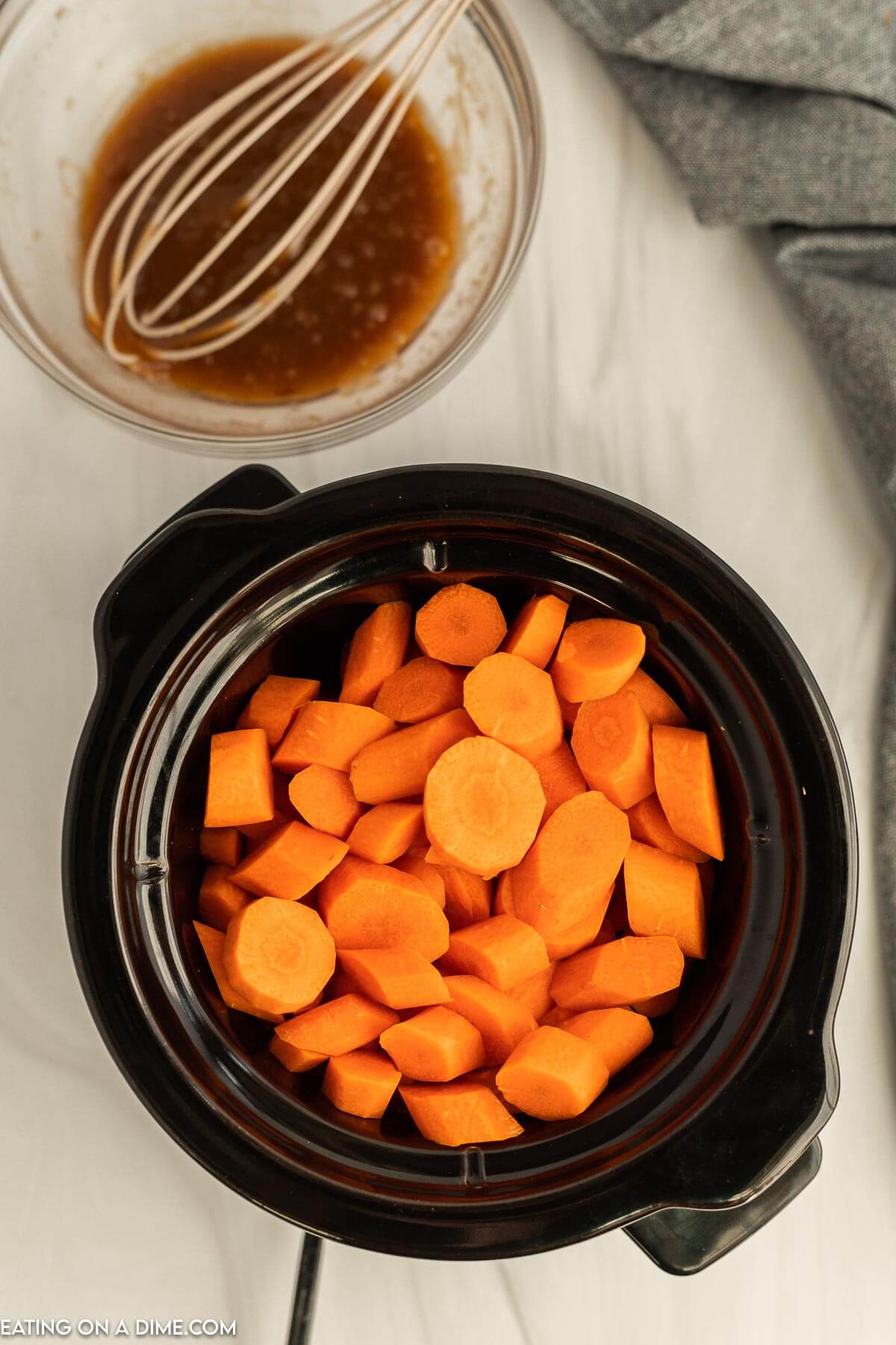 Crock pot with carrots inside. 