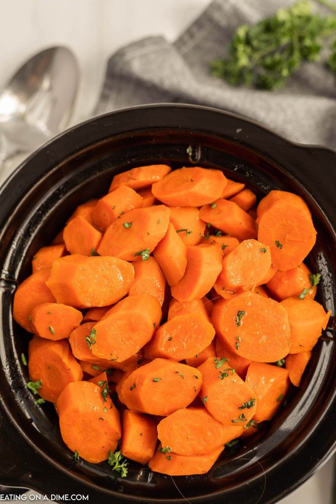 Close up image of glazed carrots in a crock pot 