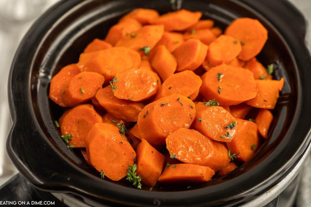 Close up image of glazed carrots in a slow cooker