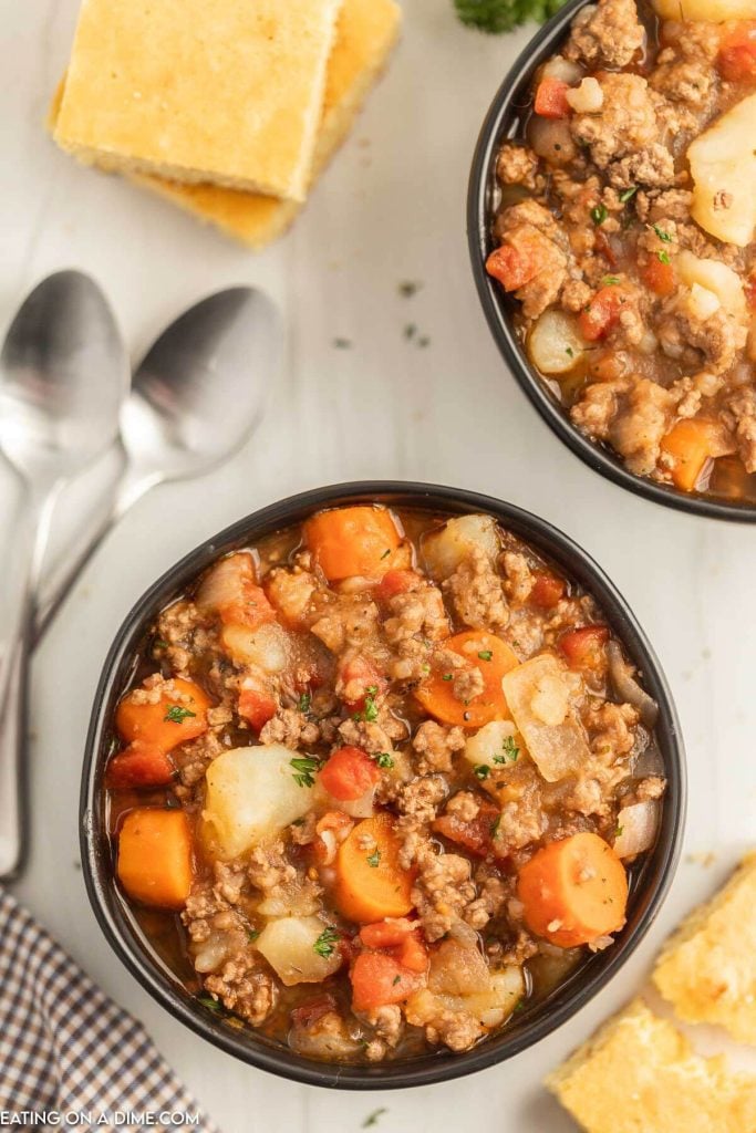 Close up image of poor mans stew in a black bowl