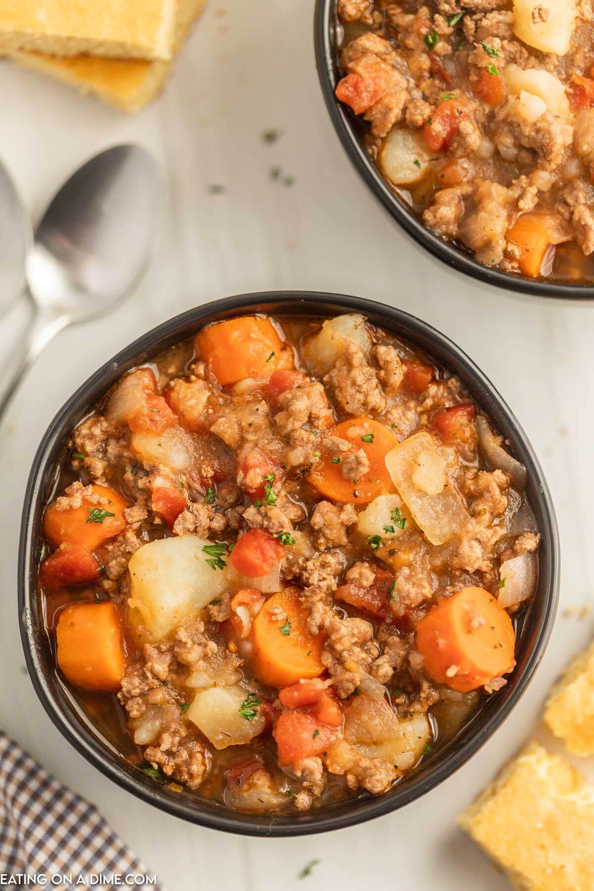 Close up image of poor mans stew in a black bowl