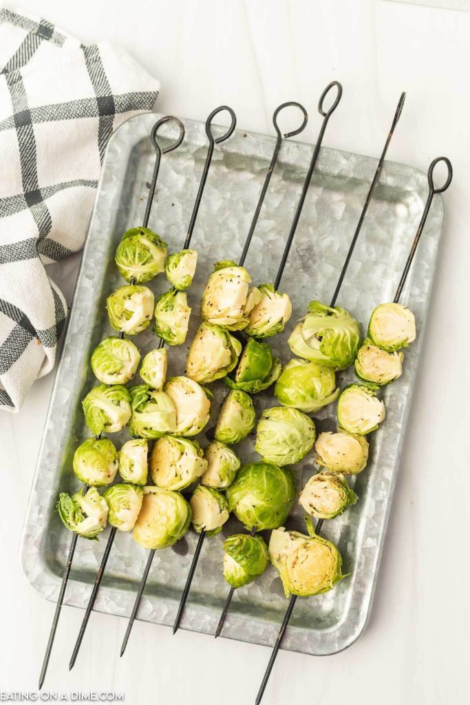 Grilled brussel sprouts on a platter.
