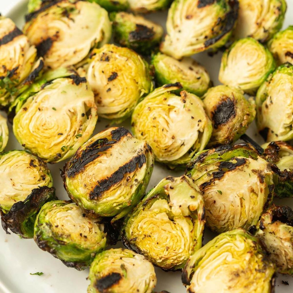 Grilled brussel sprouts on a plate. 