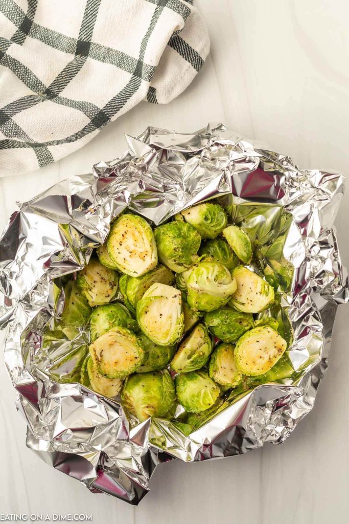 Add the seasoned brussel sprouts to the foil and make a foil packet. 