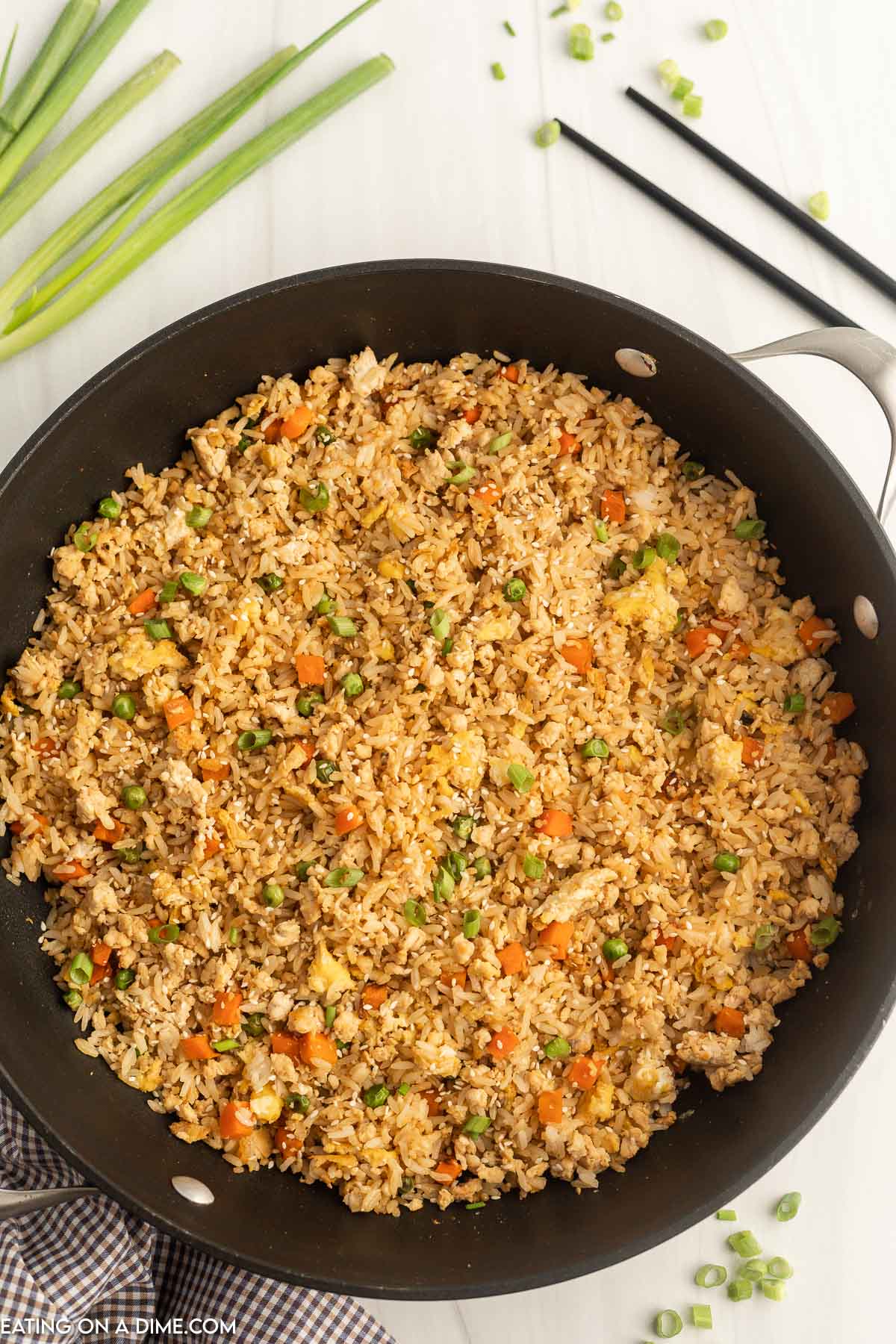 Ground chicken fried rice in a skillet. 