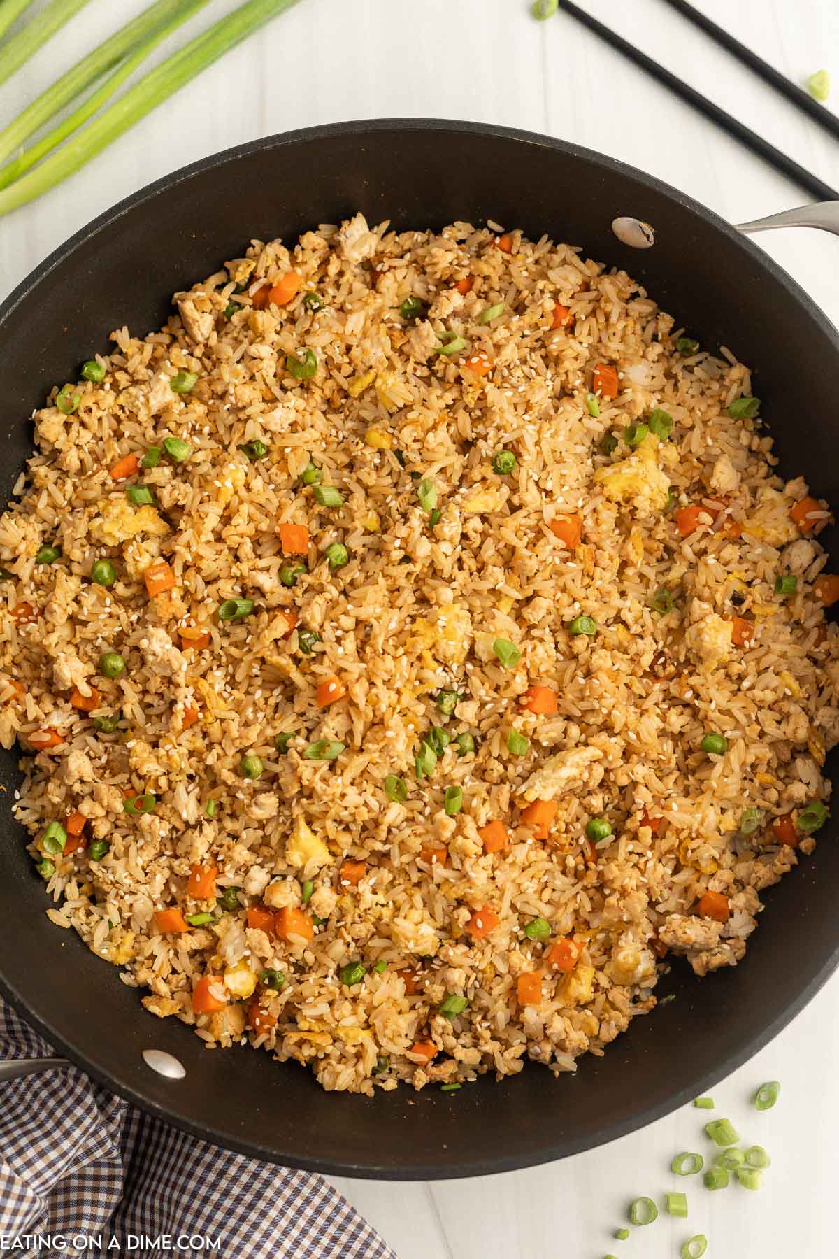 Ground chicken fried rice in a skillet. 