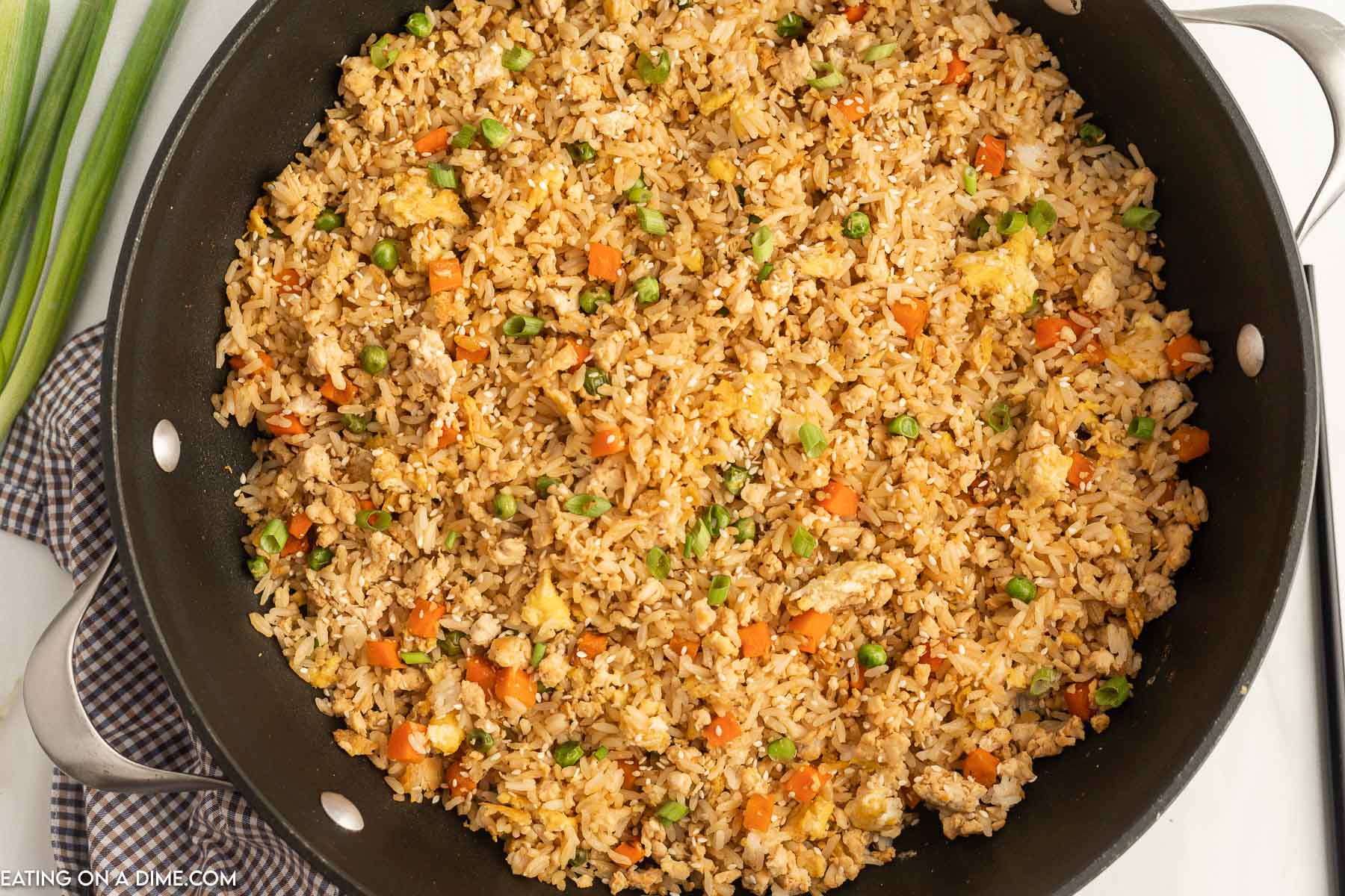 Ground chicken fried rice in a skillet. 