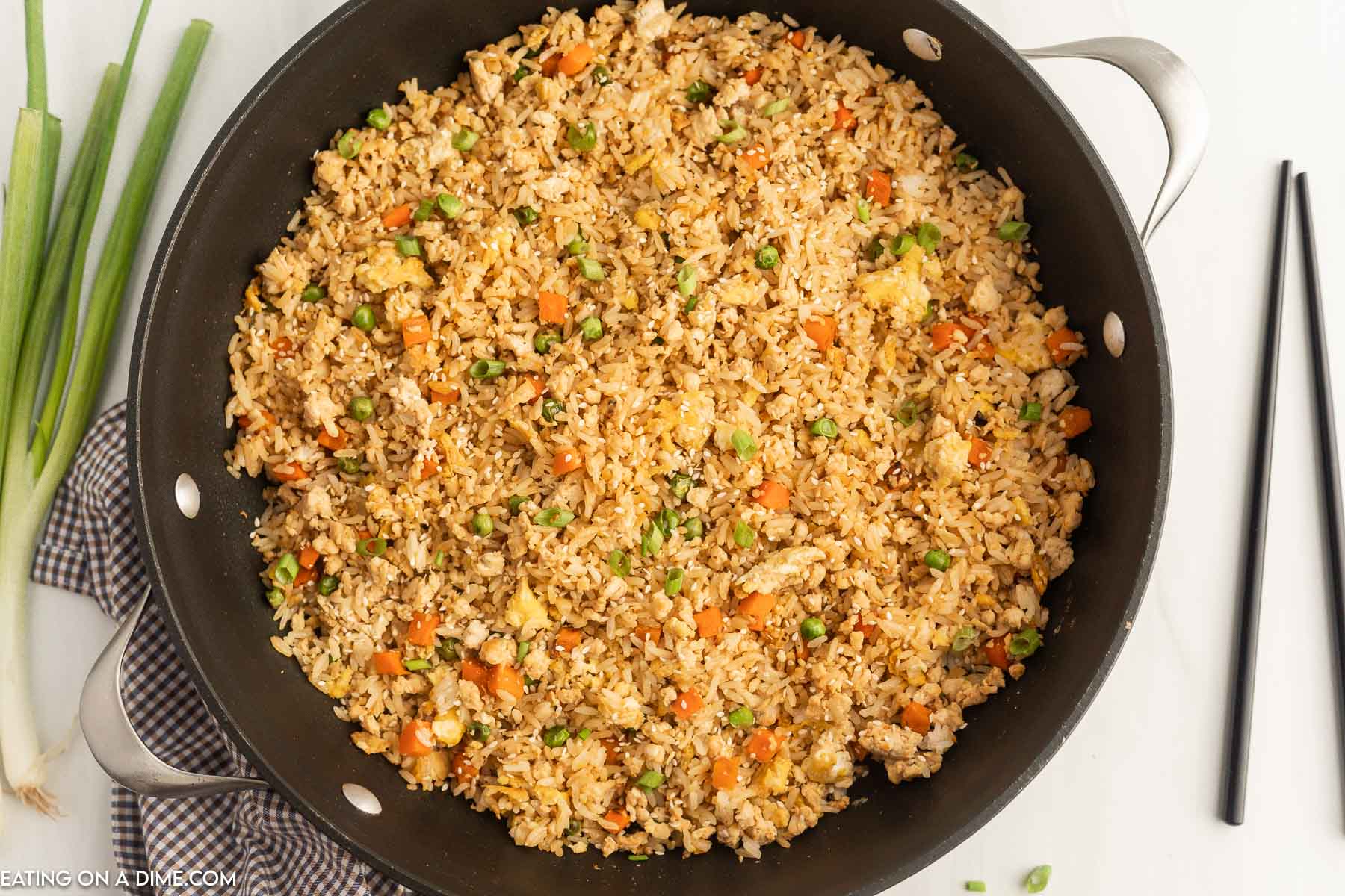 Ground chicken fried rice in a skillet. 