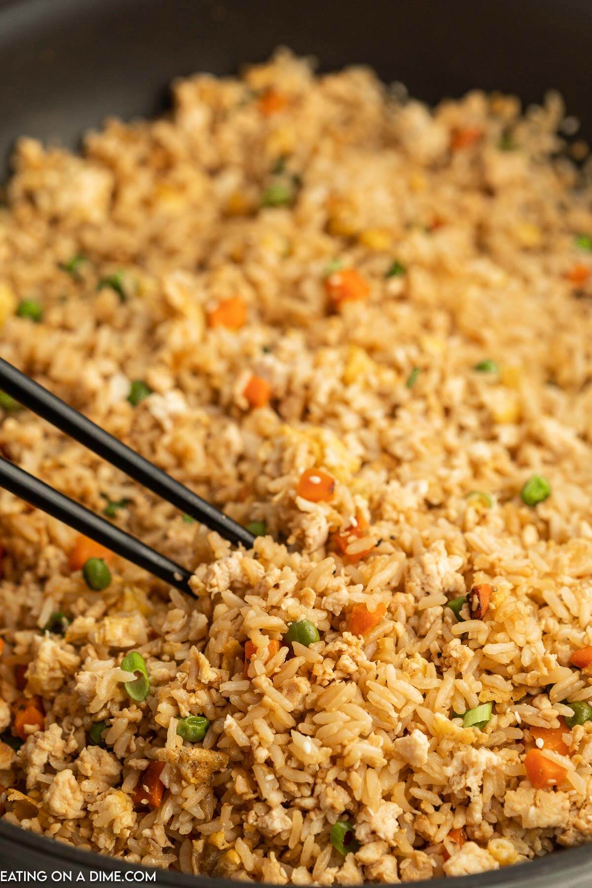 Ground chicken fried rice in a skillet. 