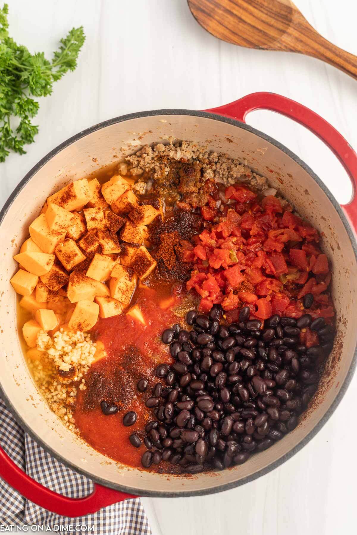 Adding the ingredients to a large pot