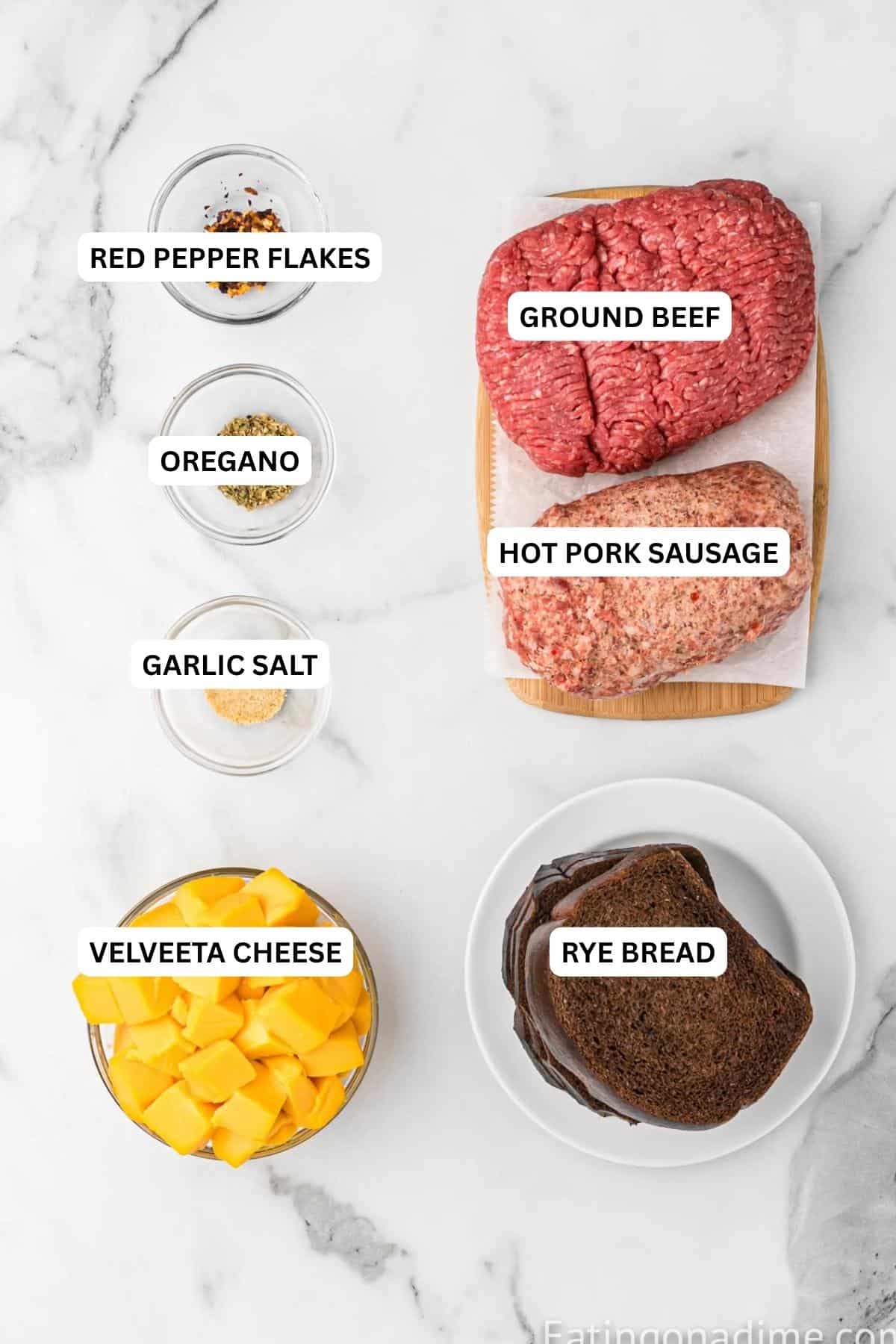 Ingredients for recipe: rye bread, Velveeta cheese, pork sausage, ground beef, garlic salt, oregano and red pepper flakes.