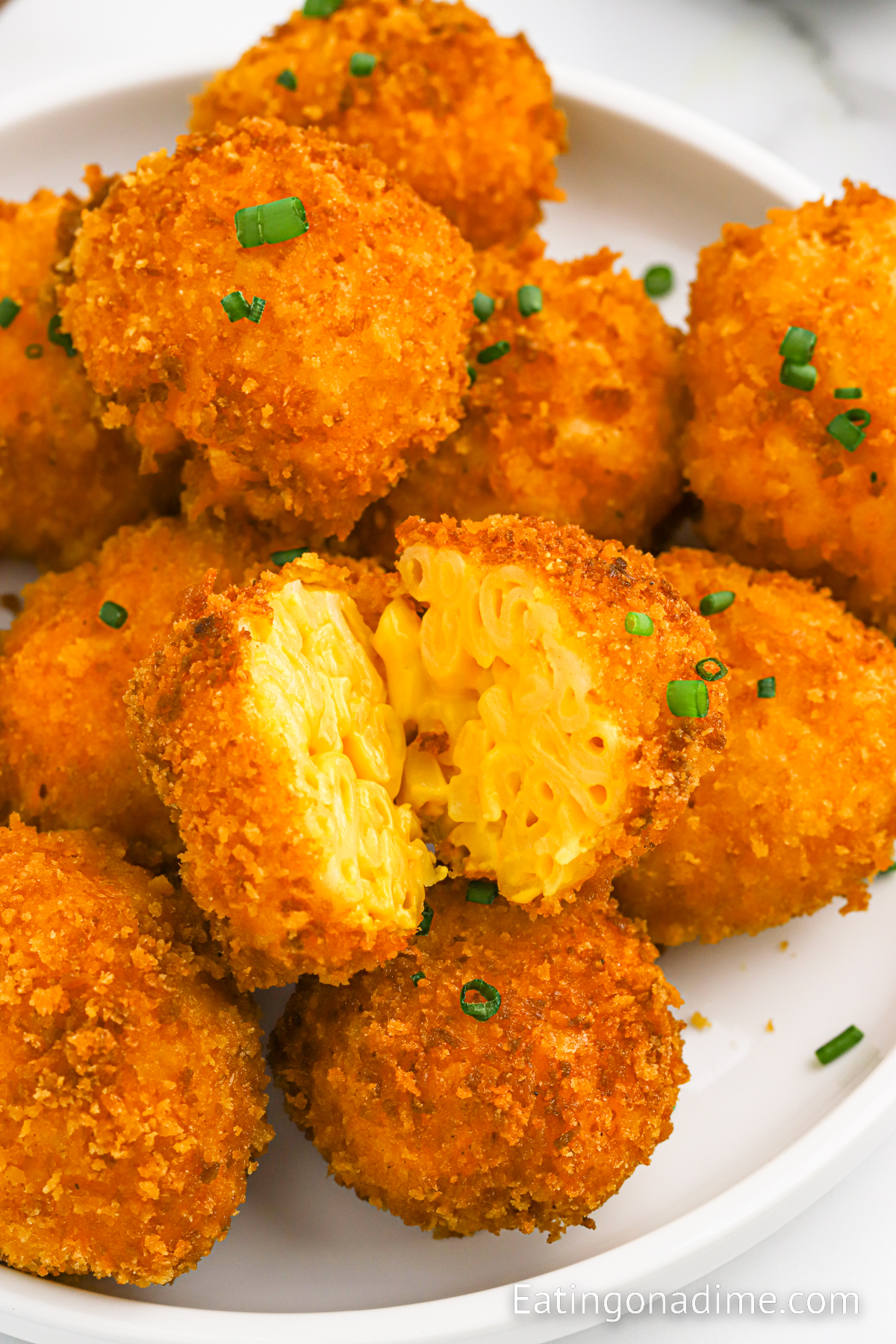 Fried Mac and Cheese Bals stacked on a plate