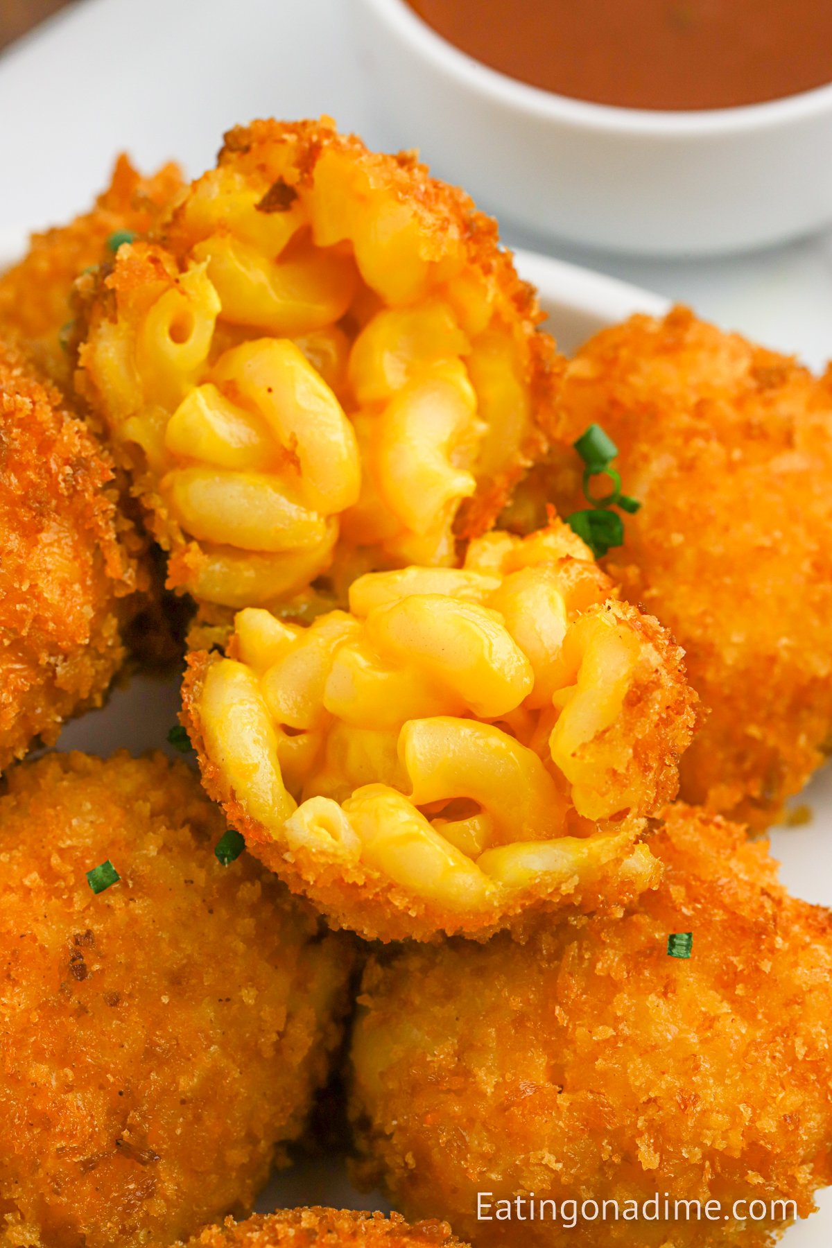 Fried Mac and Cheese Bals stacked on a plate