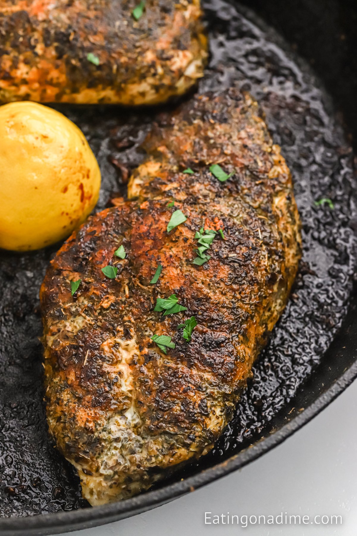 Herb Crusted Chicken sliced in a skillet