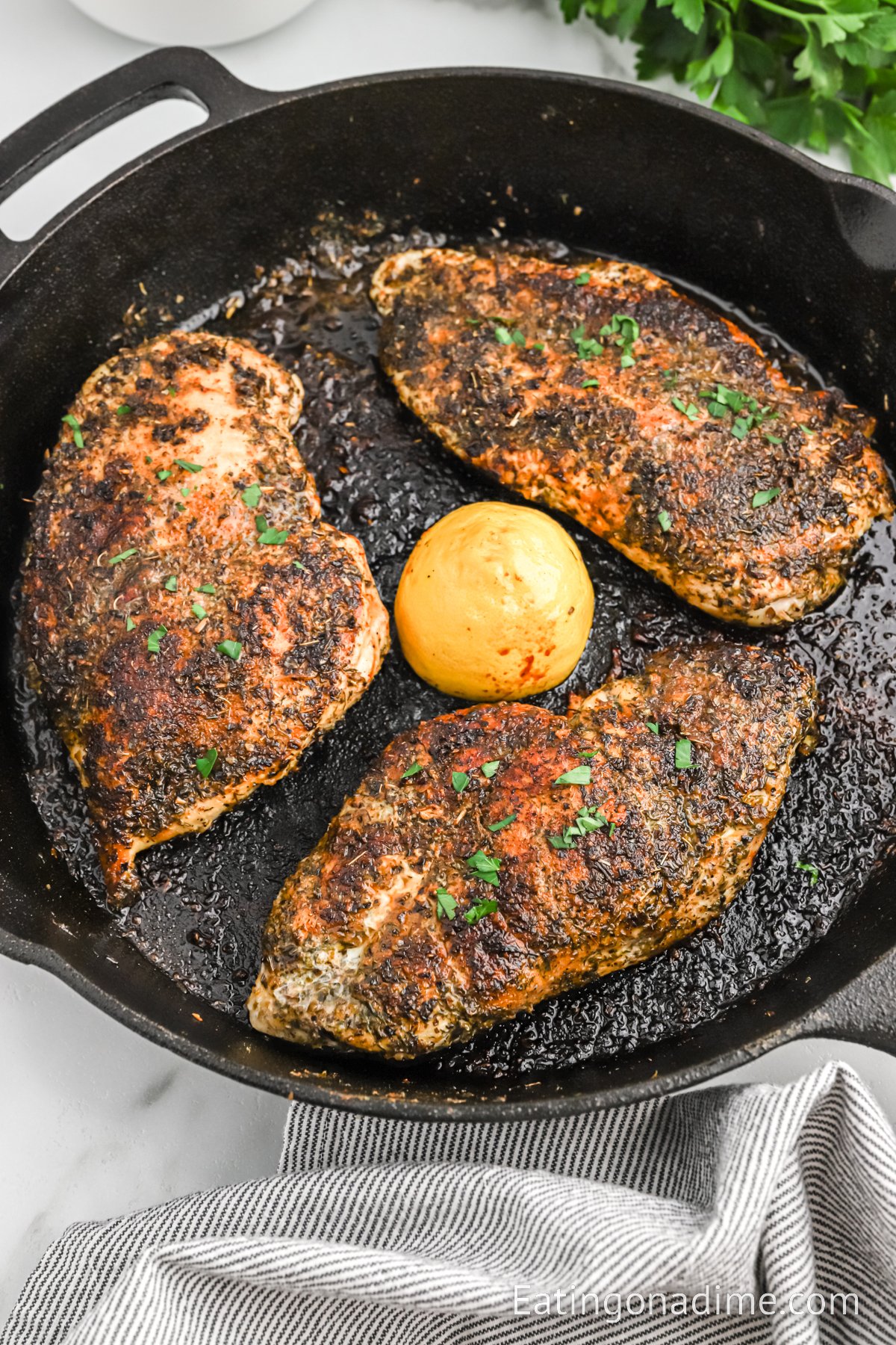 Herb crusted chicken in a cast iron skillet