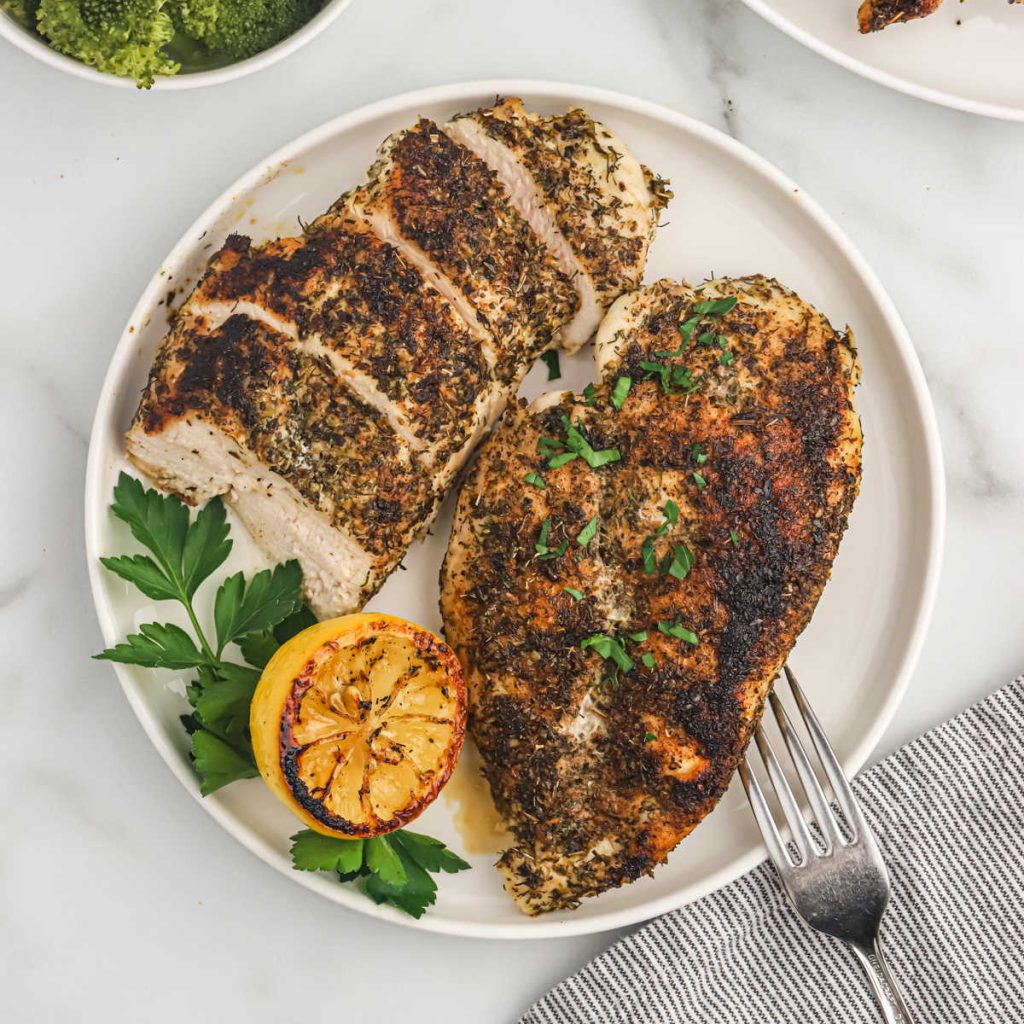 Herb Crusted Chicken sliced on a plate