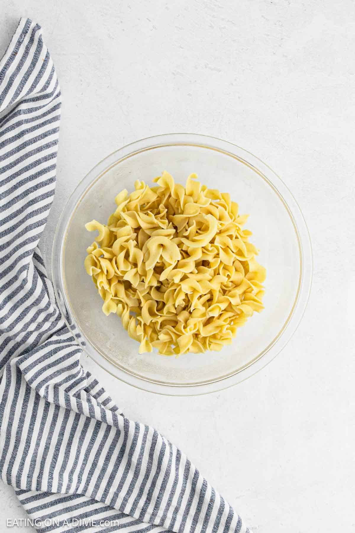 Cooked egg noodles in a bowl.