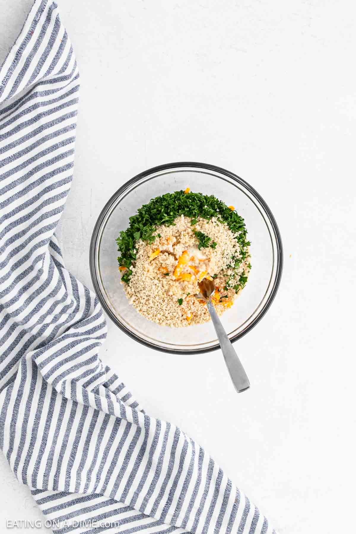 Topping ingredients added to a bowl to combine.