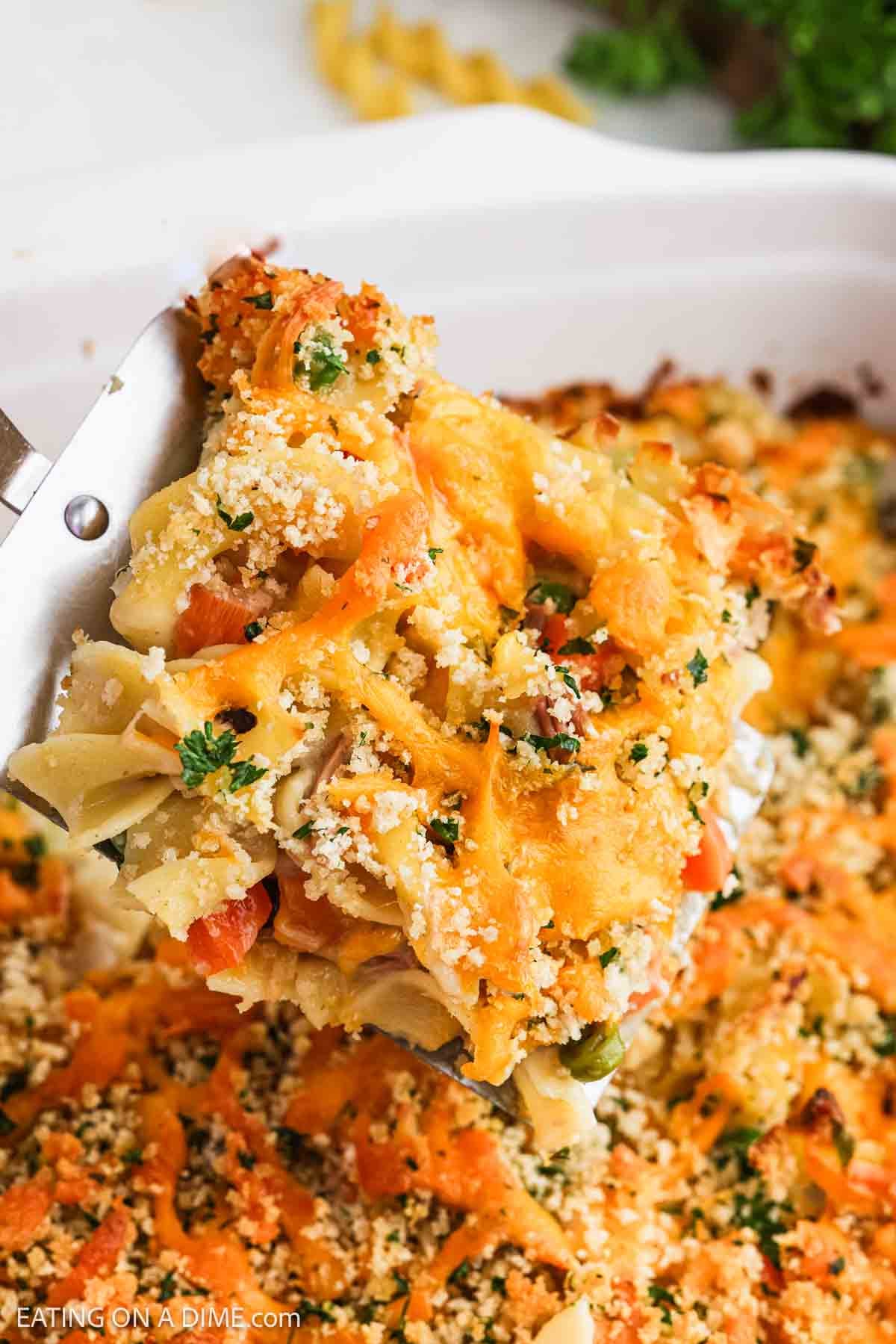 Close up image of a serving of the casserole on a spatula.