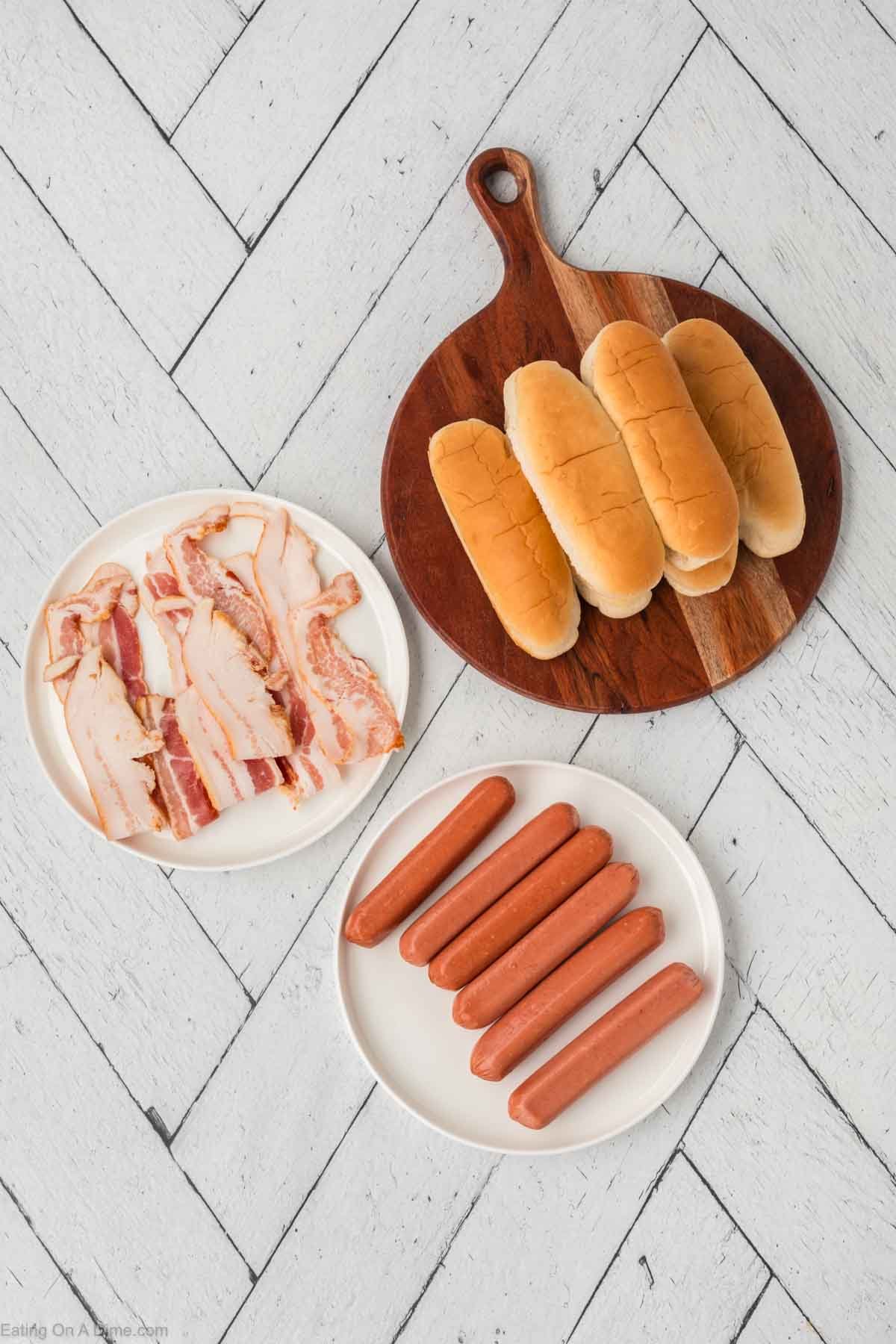 Ingredients - Hot Dog Buns, Hot Dogs, and strips of bacon