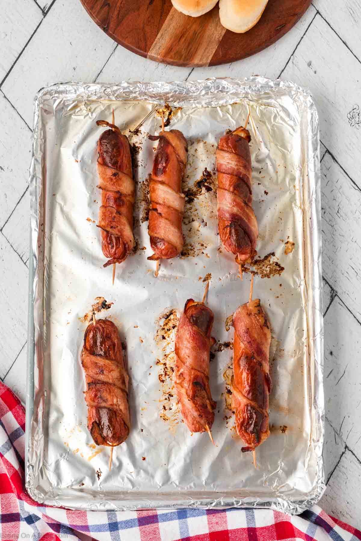 Grilled Hot Dogs on a foil lined baking sheet