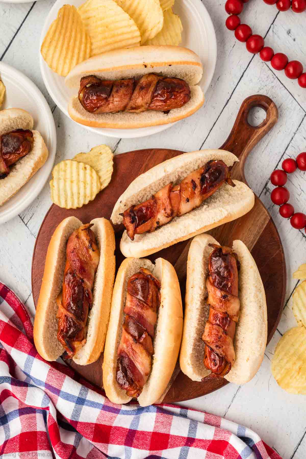 Bacon wrapped hot dogs on a platter