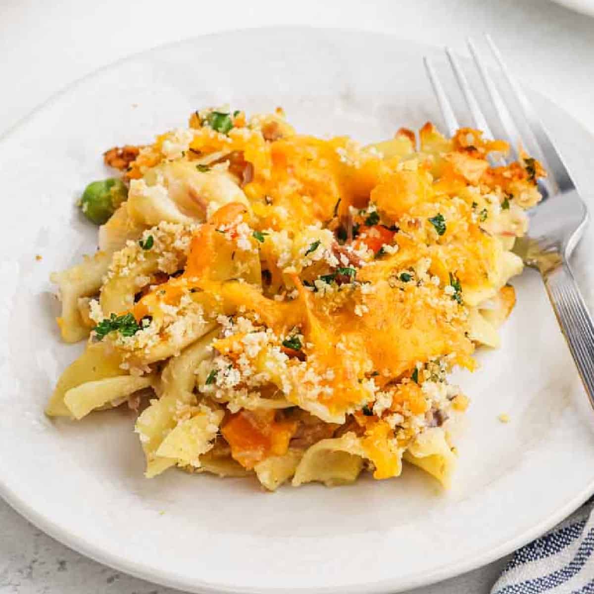 Serving of Tuna Casserole on a white plate.