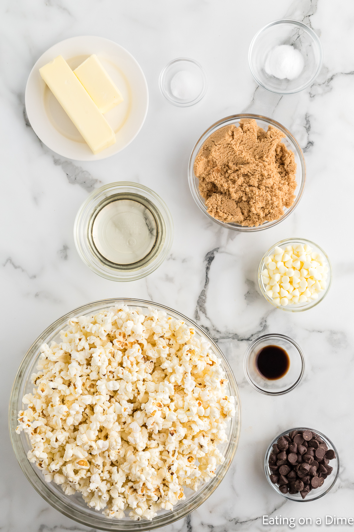 Ingredients needed - popped popcorn, brown sugar, butter, corn syrup, vanilla, white chocolate chips, dark chocolate chips