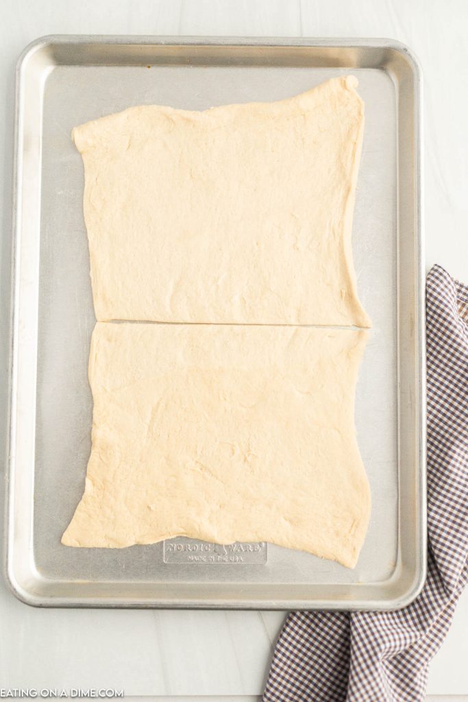 Placing crescent roll on the baking sheet