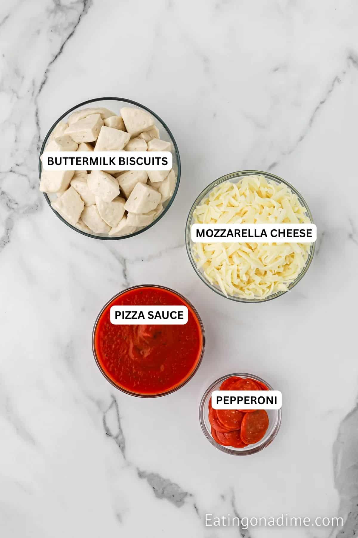 Ingredients for recipe: buttermilk biscuits, mozzarella cheese, pizza sauce and pepperoni.