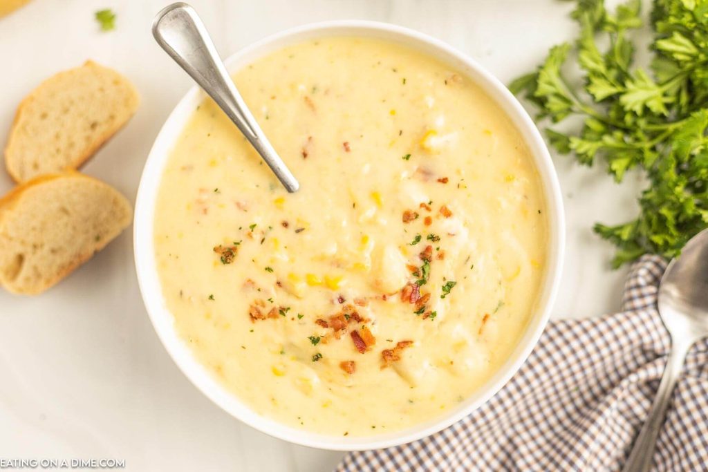Corn Chowder in a white bowl with a spoon