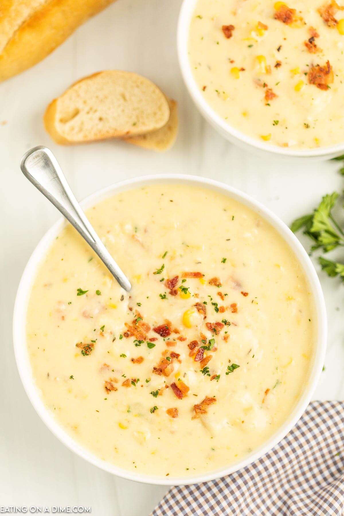 Corn Chowder in a white bowl with a spoon